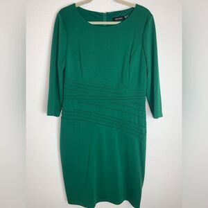 Ellen Tracey:  Dress adorned with intricate details around the waist